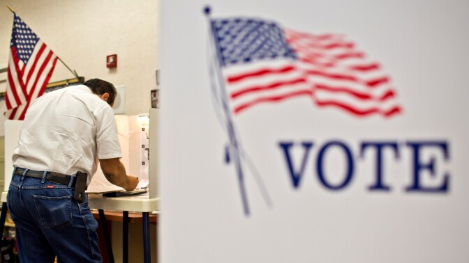 Ralph Scott of Canyon Country votes in the Los Angeles County primary election at Canyon Springs School's library on Tuesday evening, June 3 in Santa Clarita.