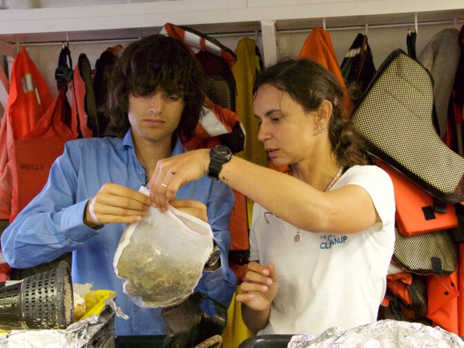 The Ocean Cleanup CEO and founder Boyan Slat and Julia Reisser, lead oceanographer, examining samples of the Great Pacific Garbage Patch, aboard Mega Expedition mothership R/V Ocean Starr.