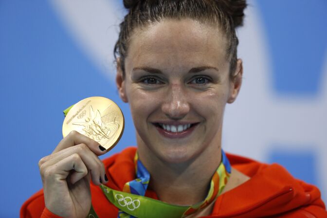 TOPSHOT - Hungary's Katinka Hosszu poses with her gold medal on the podium after she won the Women's 200m Individual Medley Final during the swimming event at the Rio 2016 Olympic Games at the Olympic Aquatics Stadium in Rio de Janeiro on August 9, 2016.   / AFP / Odd Andersen        (Photo credit should read ODD ANDERSEN/AFP/Getty Images)