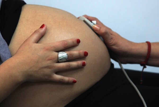 A 33-week pregnant woman is seen by a midwife in a routine checkup.