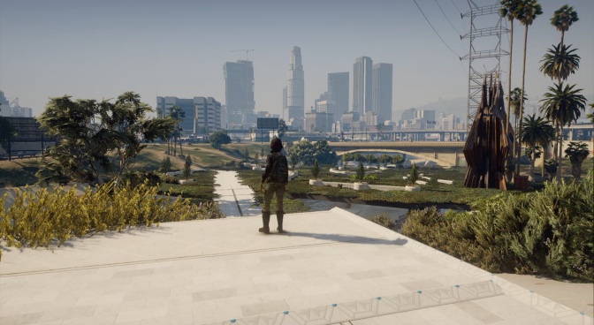 An animated image the Los Angeles skyline set in the future. A young woman, with long brown hair, is standing on a light-colored concrete slab overlooking a riverbed full of trees, plants, and water. The sky is slightly overcast and gray.