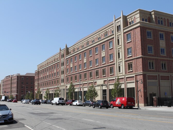 Instead of using fences, designers created a border for USC Village with buildings.