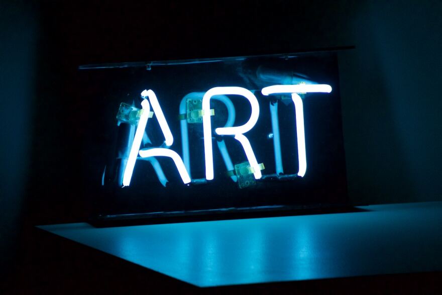A neon sign that reads, 'ART.'