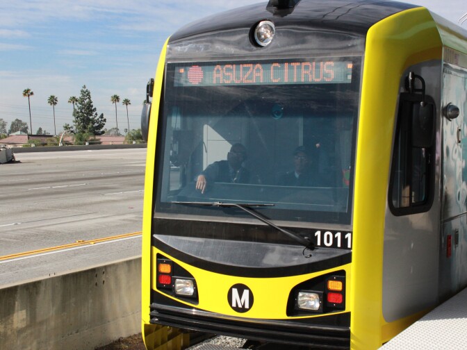 File: A new light rail vehicle for the Gold Line Foothill Extension leaves Sierra Madre Villa station headed for Azusa, which is spelled wrong on the train. 