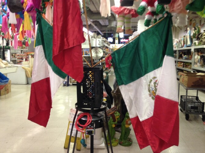 A display of Mexican flags for sale at the El Mercadito shopping center in East Los Angeles.
