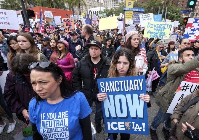 Thousands of people take part in the "Free the People Immigration March," to protest actions taken by President Donald Trump and his administration, on Feb. 18, 2017. March and rally organizers called for an end to ICE raids and deportations, minority killings by police and that health care be provided for documented and undocumented individuals. Immigrant, faith, labor and community groups called for sanctuary to be given to immigrants.