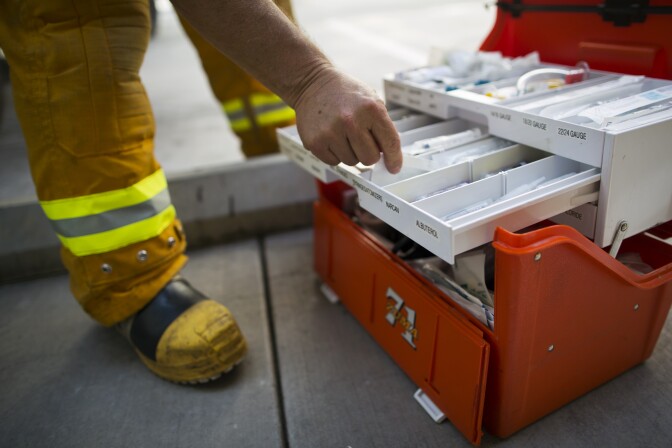 Firefighter paramedic Fred Gonzalez of Los Angeles County Fire restocks medical supplies after dropping off a patient at UCLA Medical Center and Orthopedic Hospital in Santa Monica on Monday morning, August 31, 2015. A UCLA-run pilot program starting Sept. 1 in Glendale and Santa Monica aims to reduce overcrowding, while also freeing up paramedics who get stuck waiting to pass off ER patients.