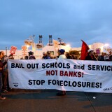 OAKLAND, CA - DECEMBER 12:  Protesters attempt to block an entrance to the Port of Oakland on December 12, 2011 in Oakland, California. Following a general strike coordinated by Occupy Oakland shut down the port on November 2 hundreds are expected to affect all West Coast ports as Occupy movements in Los Angeles, San Diego, Oakland, Portland, Seattle and Tacoma have joined the demonstration.  (Photo by Kimberly White/Getty Images)