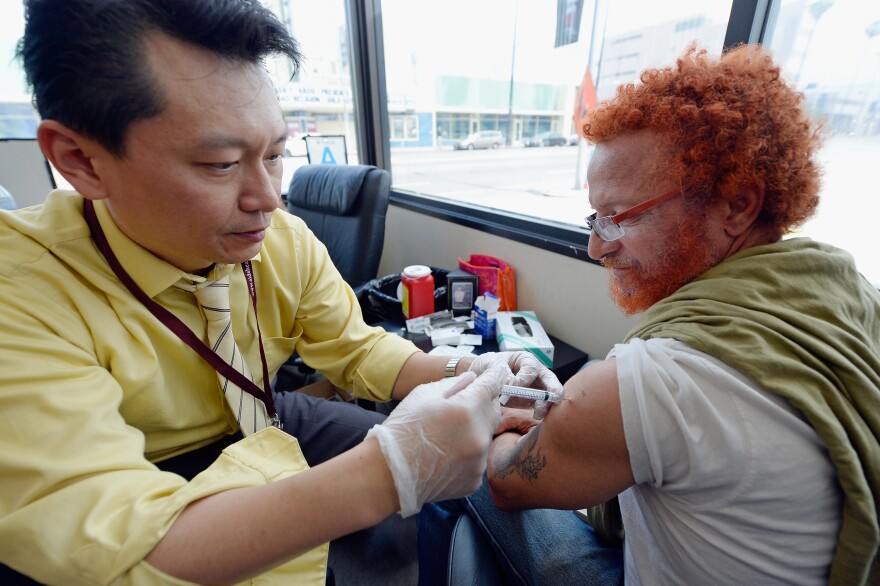 Tom Rachal (R) receives a free meningitis vaccine from Dr. Wayne Chen at the AIDS Healthcare Foundation pharmacy on April 15, 2013 in Hollywood, California. Los Angeles County's unemployment rate is 7.9%, down from 9.2% a year ago, and once again it was healthcare that added the most jobs: 22,000.