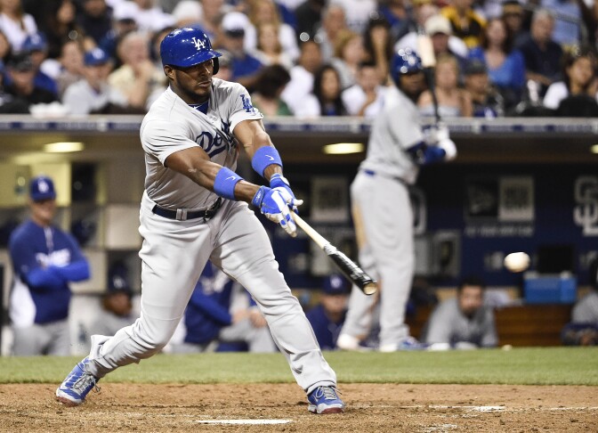 SAN DIEGO, CA - AUGUST 30:  Yasiel Puig #66 of the Los Angeles Dodgers hits a single during the eighth inning of a baseball game against the San Diego Padres at Petco Park August, 30, 2014 in San Diego, California.  (Photo by Denis Poroy/Getty Images)