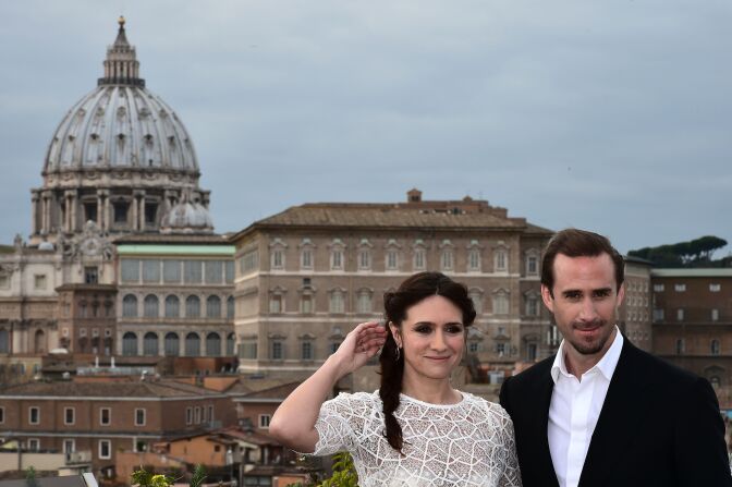 British actor Joseph Fiennes poses with Argentinian actress Maria Botto with the Vatican in the background during a photocall of the movie "Risen" on February 3, 2016 in Rome. The US biblical movie is directed by Kevin Reynolds.   AFP PHOTO / ALBERTO PIZZOLI / AFP / ALBERTO PIZZOLI        (Photo credit should read ALBERTO PIZZOLI/AFP/Getty Images)