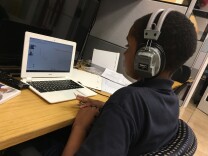 A student works with an online tutor at the Skid Row storefront where School on Wheels — which provides academic support and school supplies to homeless kids — runs an after-school program.