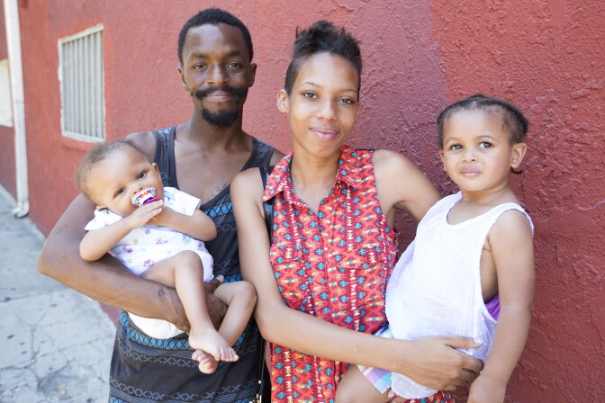 Stephanie Williams, 20, her partner Robery Lewis, 27, with baby Rieley Lewis, 9 months, and daughter Kylee Lewis, 2, outside their apartment in City West, Los Angeles on 20th June 2016. Stephanie earned her high school diploma this June through Project NATEEN at Children's Hospital Los Angeles. 
