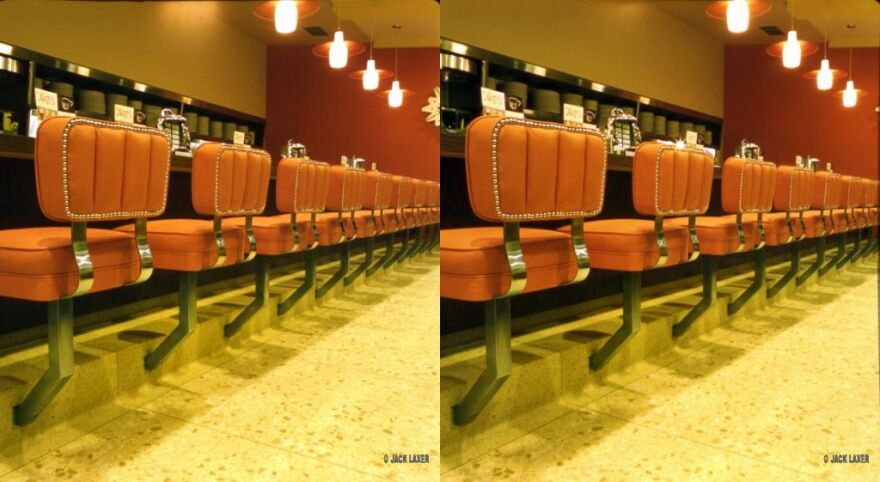 When viewed with 3-D glasses at the DRKRM gallery, the chairs in this photo zoom off the wall. 