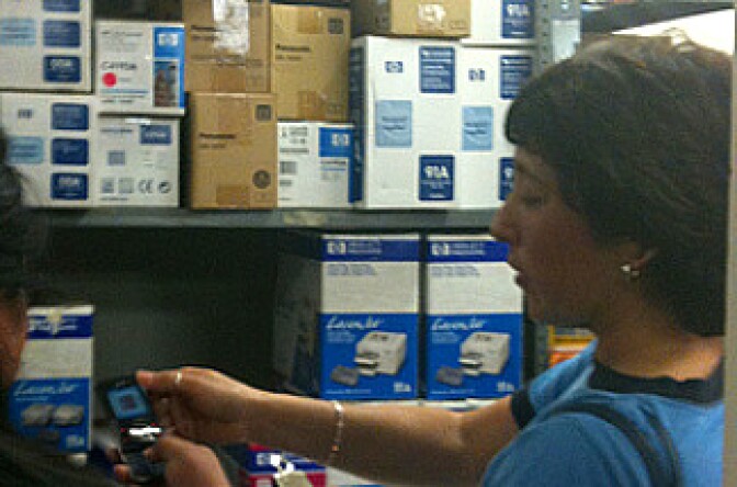 Teachers consult notes about needs, and call schools to check printer cartridge numbers. Printer cartridges are high-demand items for groups with tight budgets. 