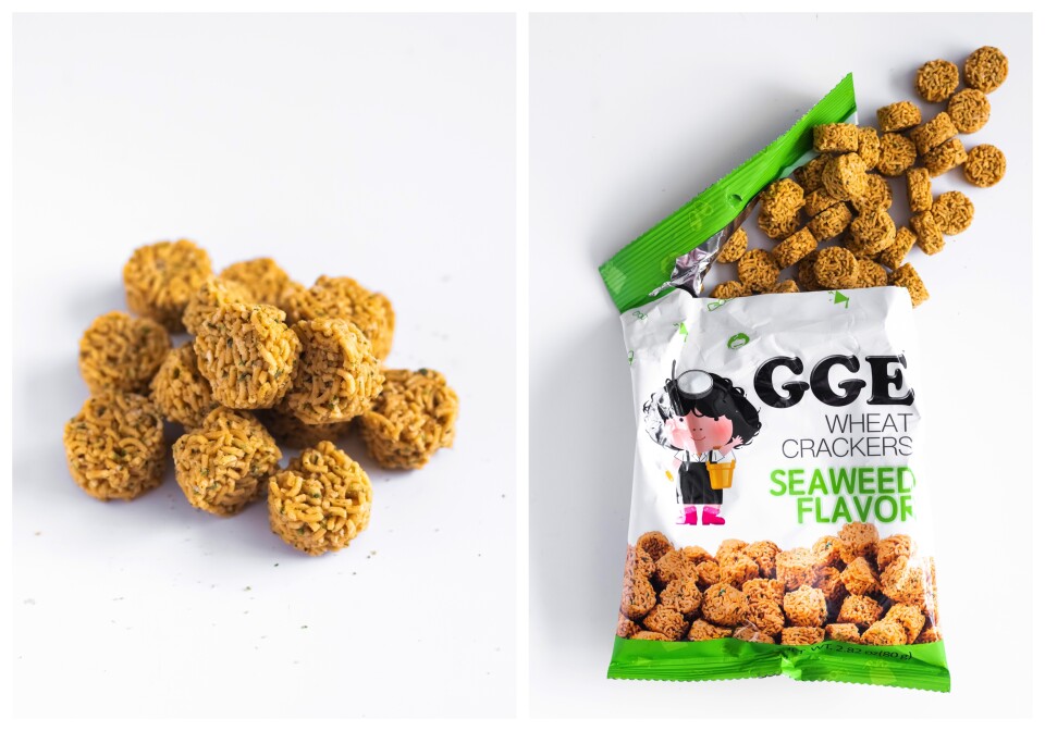 A split screen: on the left is a pile of round yellowish brown cylindrical crackers made of instant ramen noodles.  On the right is a green and white bag with GGE Wheat Crackers Seaweed flavor written on it. There's an image of a woman holding a bucket, wearing a diving mask and pink boots. 