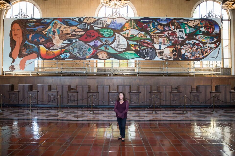 Artist Barbara Carrasco in front of "L.A. History: A Mexican Perspective" at Union Station. Los Angeles, California 2017. Courtesy Javier Guillen/LA Plaza de Cultura y Artes