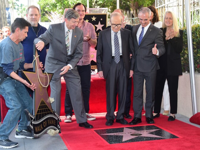 Italian composer Ennio Morricone (C) watches as his Star is unveiled on the Hollywood Walk of Fame during a ceremony on Feb. 26, 2016 in Hollywood.