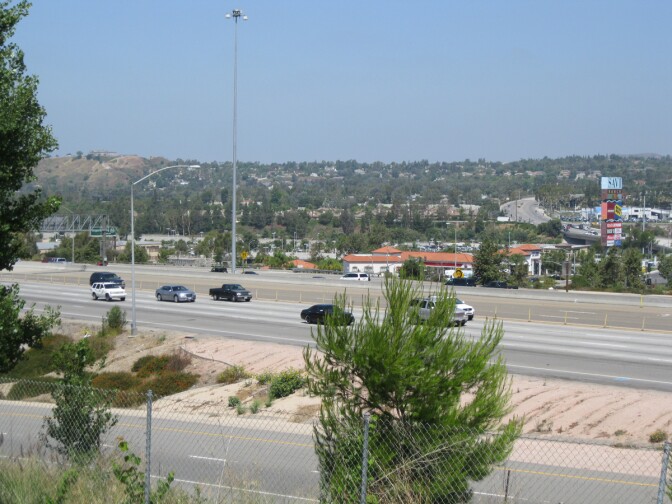 Traffic flows midday Monday on the 91 Freeway through Anaheim Hills.  The second phase of widening the freeway aims to alleviate standstill rush hour traffic through this area.
