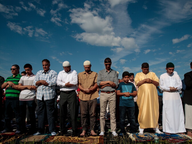 NEW YORK, NY - JUNE 25:  Muslim men participate in a group prayer service during Eid al-Fitr, which marks the end of the Muslim holy month of Ramadan, in Bensonhurst Park in the Brooklyn borough June 25, 2017 in New York City. Muslims around the world are celebrating Eid al-Fitr, which means 'festival of breaking the fast' to mark the end of Ramadan. (Photo by Drew Angerer/Getty Images)