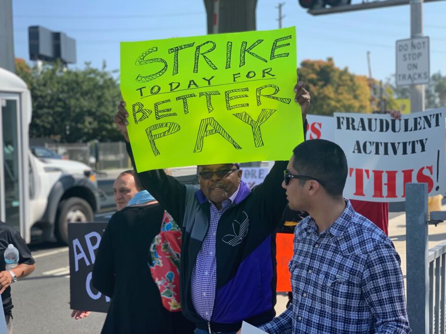 A protestor strikes for higher wages at Uber's Redondo Beach offices.