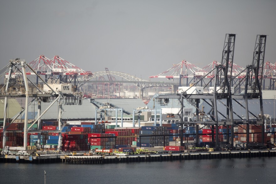 Cargo ships are loaded at the Ports of Los Angeles and Long Beach on Friday, Feb. 19, 2016.
