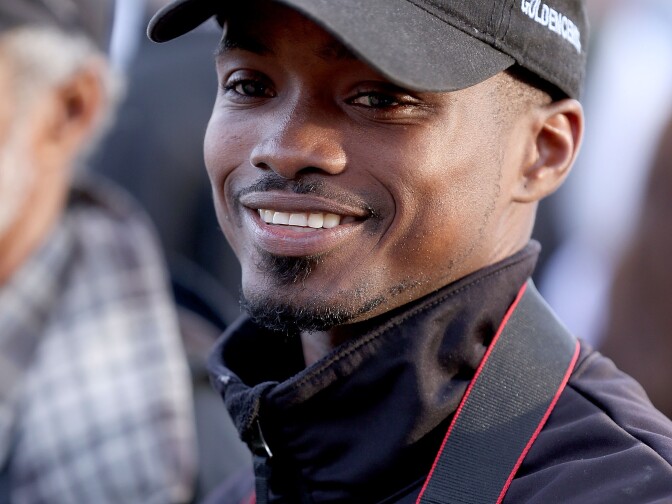 Kevin Krigger the jockey of Goldencents walks the backside during the morning training for the 2013 Kentucky Derby at Churchill Downs on May 2, 2013 in Louisville, Kentucky. 