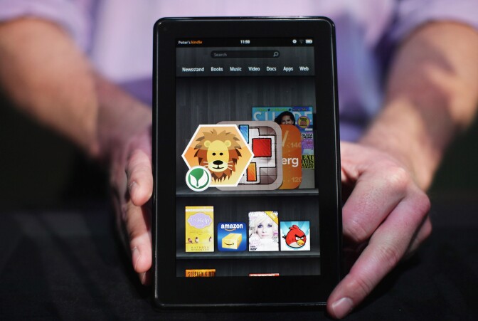 NEW YORK, NY - SEPTEMBER 28:  The new Amazon tablet called the Kindle Fire is displayed on September 28, 2011 in New York City. The Fire, which will be priced at $199, is an expanded version of the company’s Kindle e-reader that has 8GB of storage and WiFi. The Fire gives users access to streaming video, as well as e-books, apps and music, and has a Web browser. In addition to the Fire, Bezos introduced four new Kindles including a Kindle touch model.  (Photo by Spencer Platt/Getty Images)