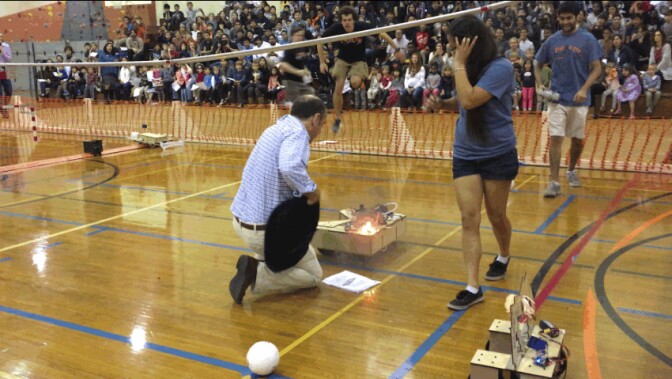 A robot catches fire during the 31st annual Tridroid Cup in a soccer match between robots at Caltech.
