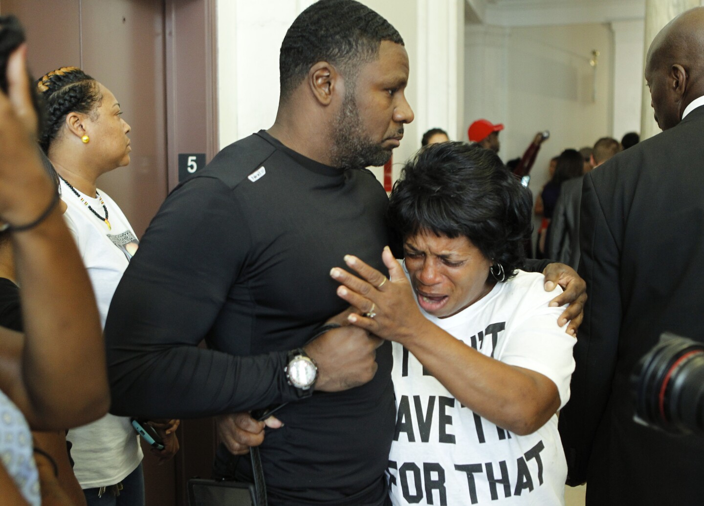 CINCINNATI, OH - JULY 30:  Family and friends of Samuel DuBose console each other after former University of Cincinnati police officer Ray Tensing was arraigned on murder charges in Hamilton County Common Pleas Court July 30,  2014 in Cincinnati, Ohio. Tensing, 25, pleaded not guilty in the shooting death of Dubose during a routine traffic stop on July 19. Bond was set at $1 million.  (Photo by Mark Lyons/Getty Images)