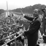 File: Martin Luther KIng (C) waves to supporters from the steps of the Lincoln Memorial August 28, 1963.