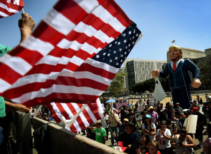Members of the 'Full Rights for Immigrants Coalition' display a giant effigy of US Republican Party presidential hopeful Donald Trump during a protest on May Day in Los Angeles, California on May 1, 2016. / AFP / Mark Ralston        (Photo credit should read MARK RALSTON/AFP/Getty Images)