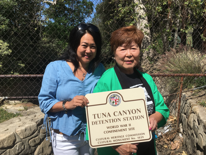 Donna Sugimoto, left, and Nancy Oda at the site of the former Tuna Canyon Detention Station, designated a historic-cultural monument by the city of Los Angeles. A sign commemorating the site's history as a detention camp for Japanese, Italian and German immigrants during WWII was unveiled Thursday.