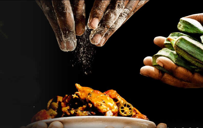 hands sprinkle some sort of seasoning on a plate of orange food while another pair of hands holds raw okra