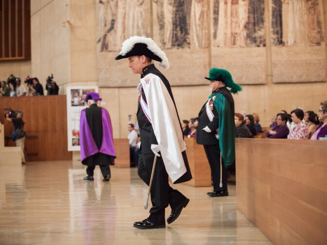 Dean Smith from the knights of Columbus Color Core walks towards the altar at the Cathedral of Our Lady of the Angels on March 13th, 2013 after Jorge Mario Bergoglio of Argentina was named Pope Francis I.