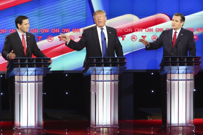 Republican presidential candidates, Sen. Marco Rubio (R-FL), Donald Trump and Sen. Ted Cruz (R-TX) listen as answers a question during the Republican presidential debate at the University of Houston.