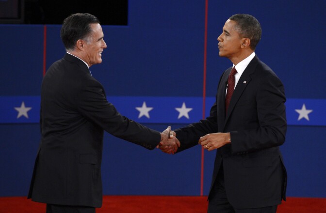 US President Barack Obama (R) and Republican presidential candidate Mitt Romney (L) shake hands following the second presidential debate at the David Mack Center at Hofstra University in Hempstead, New York, October 16, 2012, moderated by CNN's Candy Crowley.