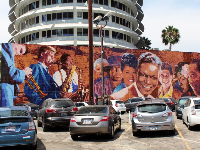 "Hollywood Jazz: 1945-1972," also known as the Capitol Records Jazz Mural, on the south wall of the Capitol Records Building, painted by artist Richard Wyatt in 1990. The mural depicts Billie Holiday alongside Chet Baker, Gerry Mulligan, Charlie Parker, Tito Puente, Miles Davis, Ella Fitzgerald, Shelly Manne, Dizzy Gillespie, Duke Ellington and Nat "King" Cole.