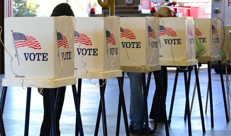 Citizens vote on Election Day at Fire Station #71 in Alhambra, Los Angeles County, on November 6, 2012 in California, as Americans flock to the polls nationwide to decide between President Barack Obama, his Rebuplican challenger Mitt Romney, and a wide range of other issues. Alhambra is one of 6 cities in California's 49th Assembly District, the state's first legislative district where Asian-Americans make up the majority of the population. AFP PHOTO / Frederic J. BROWN        (Photo credit should read FREDERIC J. BROWN/AFP/Getty Images)