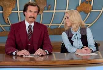 Will Ferrell and Christina Applegate sit at a large desk infront of a backdrop of a outlined globe. Their characters are news anchors from the 70s. Ferrell wears a red, burgundy suit while Applegate wears a light blue pussy-bow blouse with a  grey sweater vest.