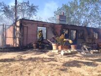 At least one home has burned in the Summit Fire on May 1, 2013.