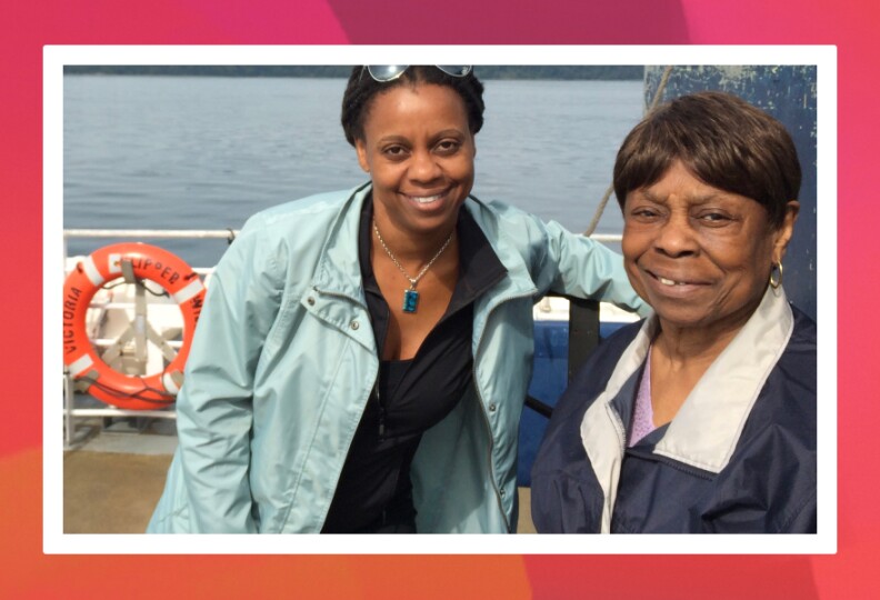 The author and her grandmother on boat, an orange life ring labeled Victoria Clipper can be seen behind them.