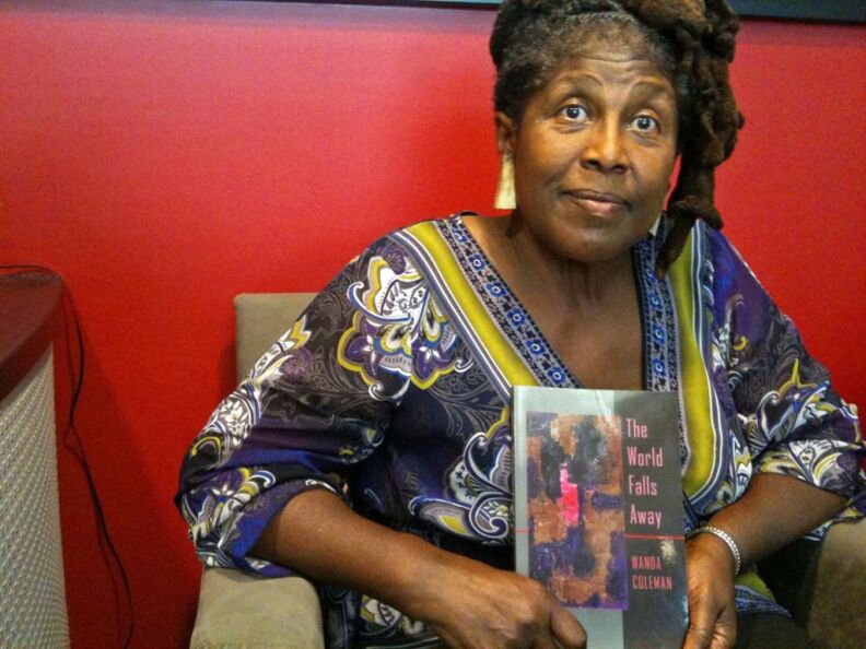 Poet Wanda Coleman with her latest collection, "The World Falls Away."