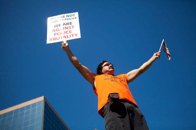 A protester marches through the streets of Anaheim to show outrage for the shooting death of Manuel Angel Diaz, 25, at Anaheim City Hall on July 24, 2012 in Anaheim.