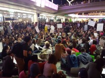 As the evening wore on, protesters convened outside the Tom Bradley International terminal at Los Angeles International Airport on Sunday, Jan. 29, 2017. The protesters were calling for the release of immigrants detained under President Donald Trump's executive order effectively banning travel from seven majority Muslim nations.