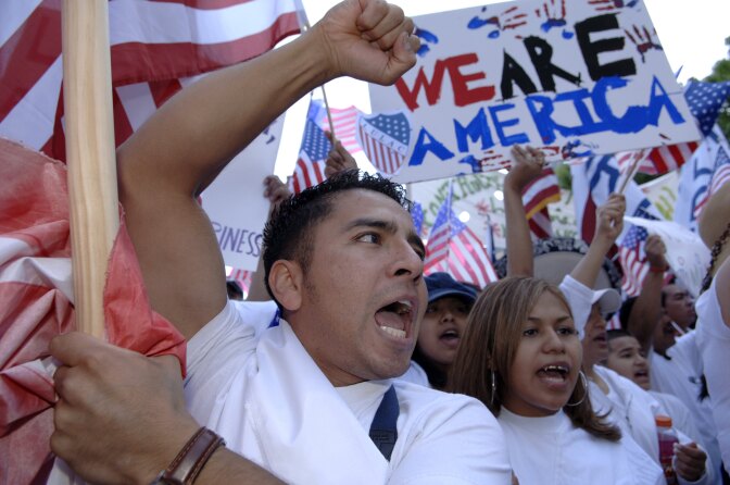 Juan R. Ramirez gestures as he leads the front of the Mega March protest on City Hall in Dallas, Texas.