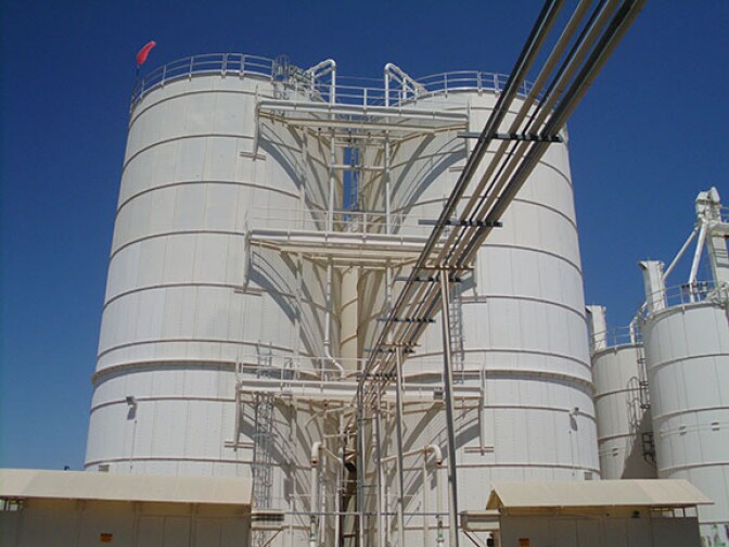Two large storage tanks at the Yuma Desalting Plant stand a few stories above ground.  