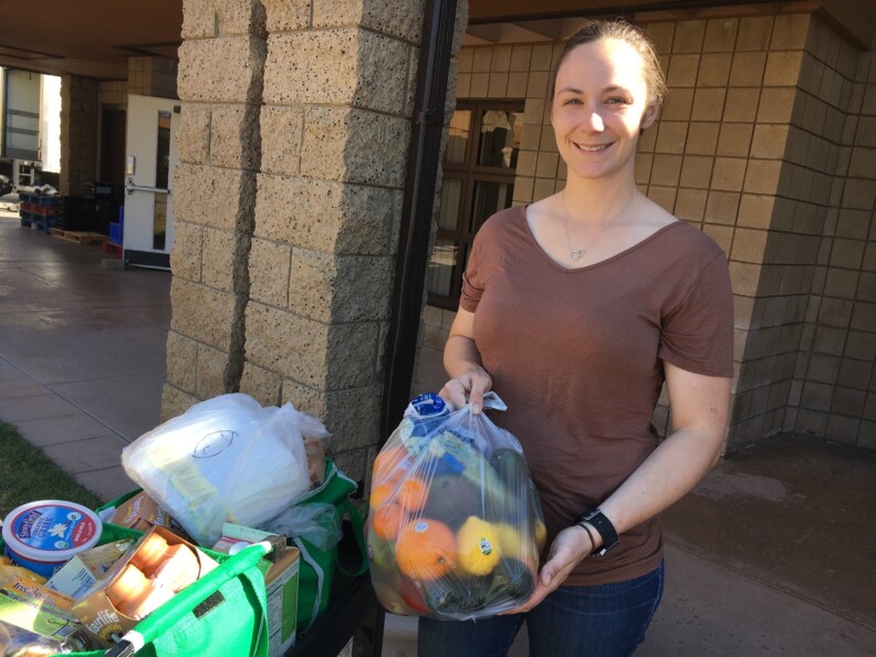 Kara Dethlefsen, 27, an active duty Marine, attends the monthly food pantry at the Camp Pendleton Marine Corps Base near San Diego on April 5, 2017. Her husband is also a Marine and she said the food assistance helps them get ready for his transition back to civilian life and with the raising of their 4-month-old daughter.