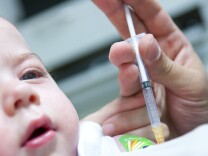 Child getting vaccinated for measles, mumps, and rubella (MMR)