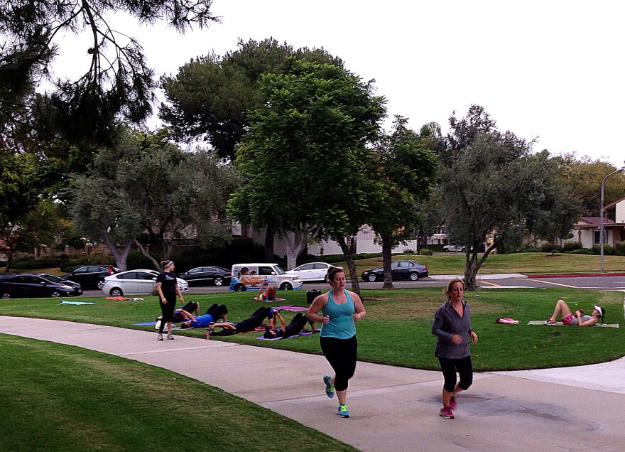 Irvine residents exercise at the end of the work day by one of the city's parks.